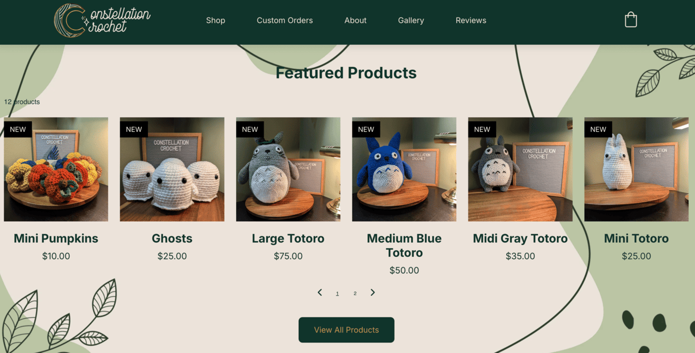 Constellation Crochet featured products page showing six crocheted plushies, including mini pumpkins, ghost figures, and Totoro characters in various sizes, priced from to