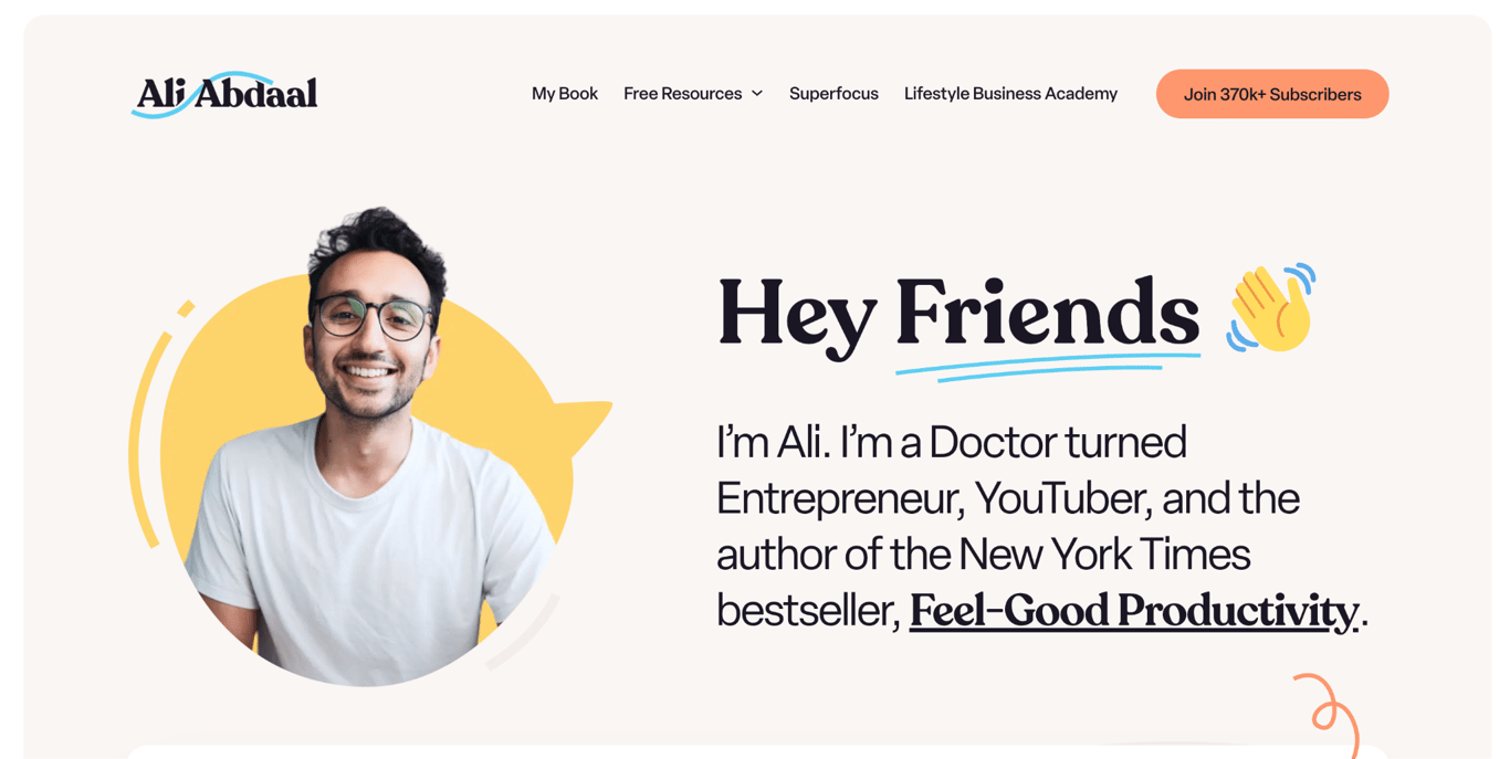 Ali Abdaal's homepage hero section with a smiling headshot, the headline