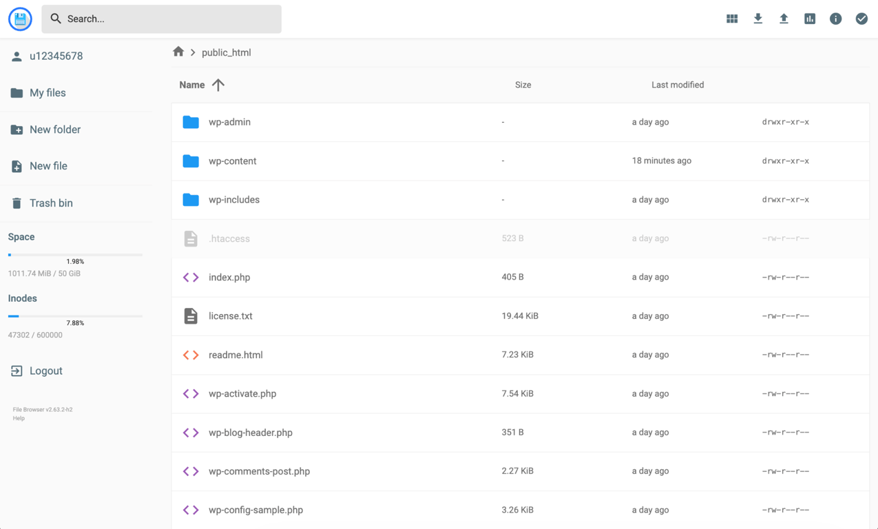 The Hostinger File Manager showing the public_html folder with WordPress files — wp-admin, wp-content, wp-includes, index.php, and other root files — sitting directly in the folder with no subfolder.