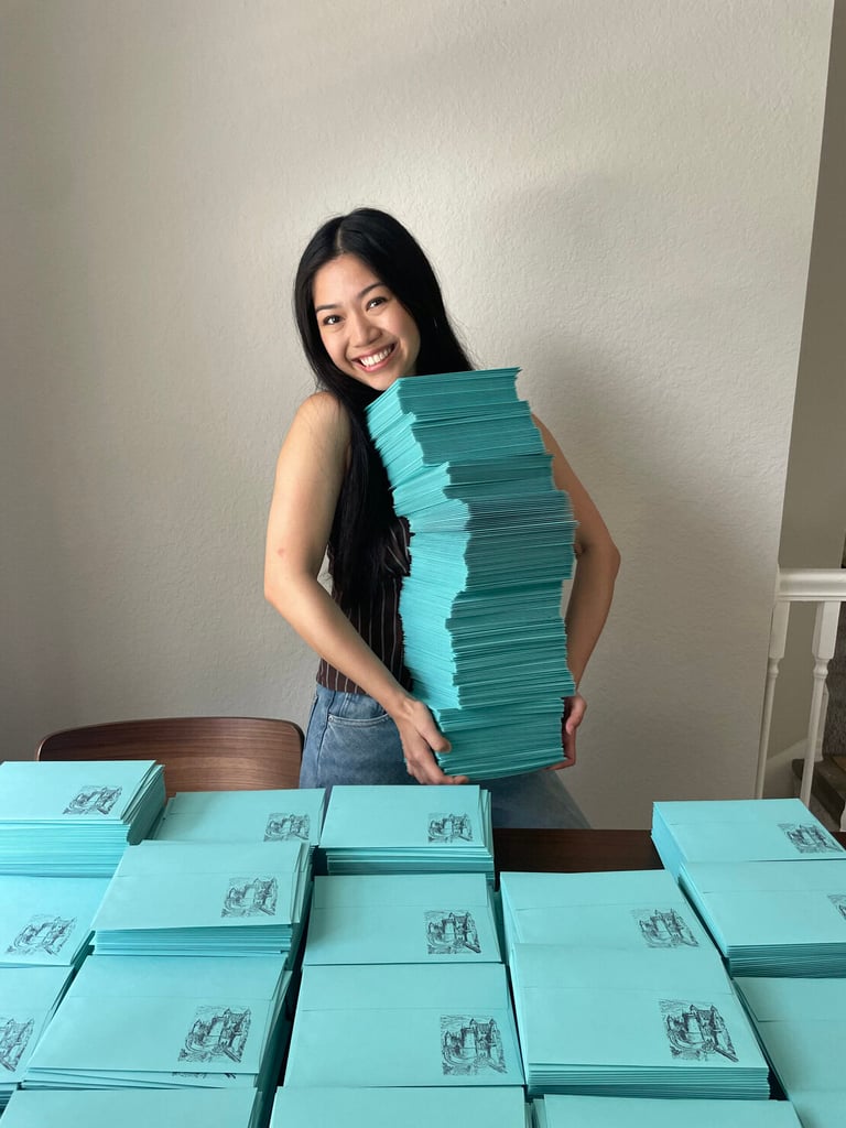 Trinity holding the envelopes of her Architecture Mail Club