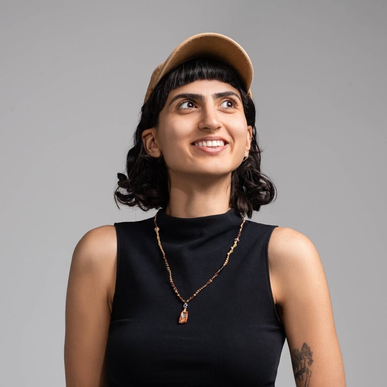 Eylül Güleryüz, AI engineer at Hostinger, smiling and looking to the side