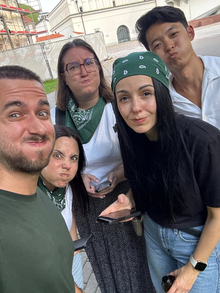 Green team making silly faces together