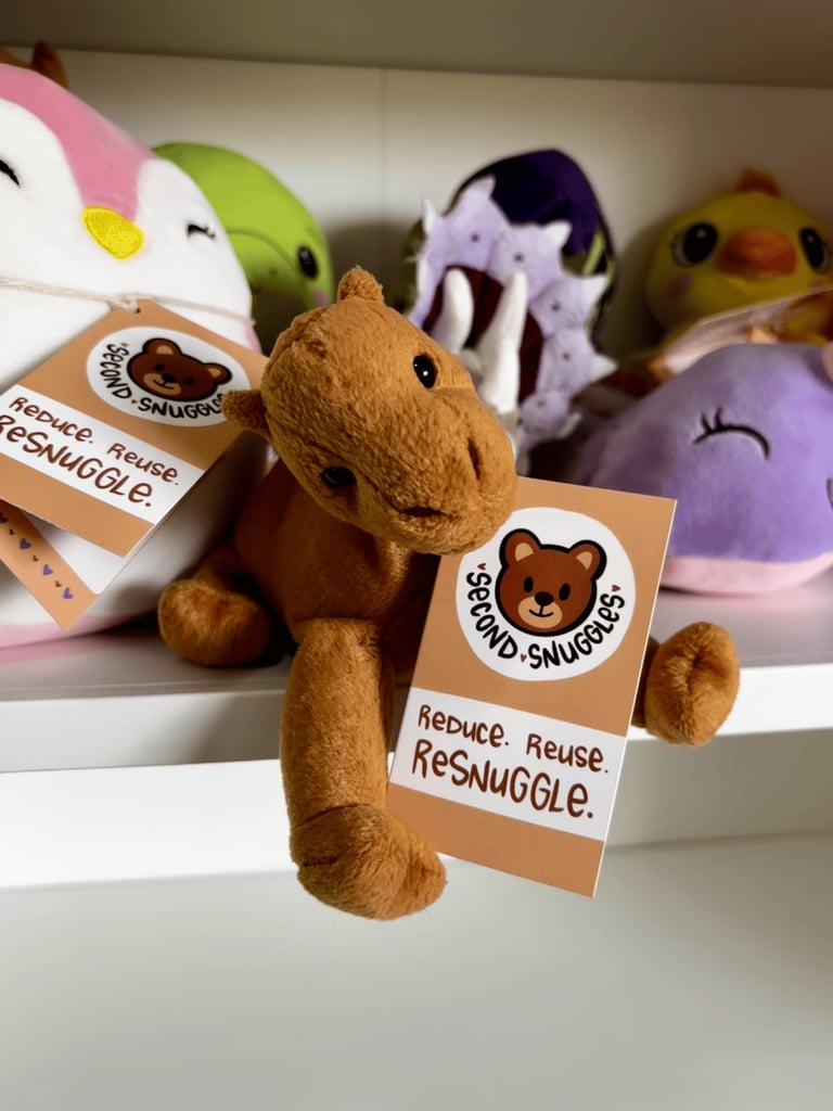 Second Snuggles plushies alongside the tags