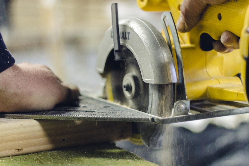 Close-up of a DeWalt circular saw cutting a board