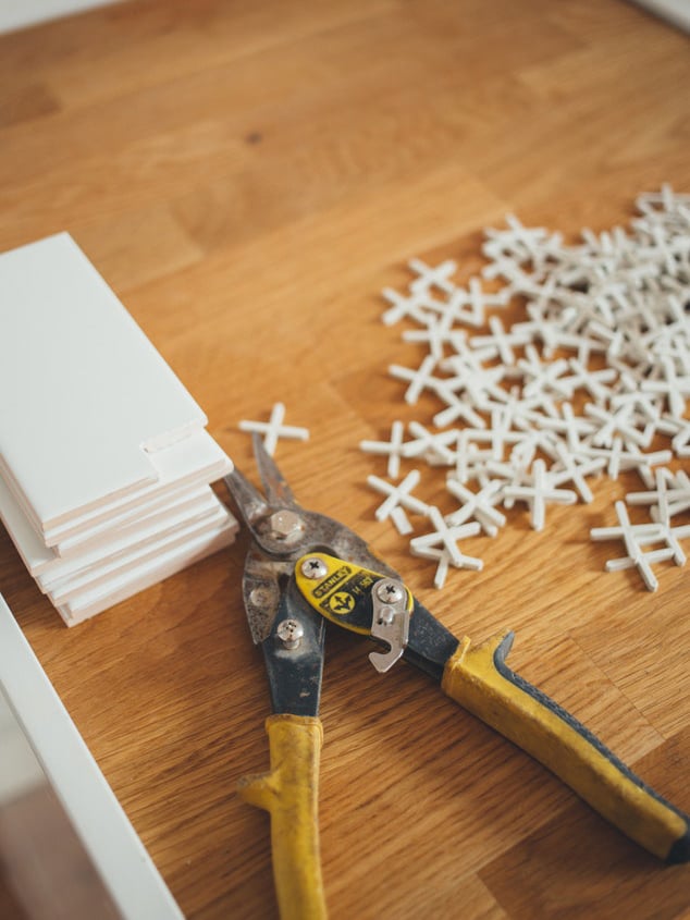 Tile spacers and tools during a tile installation