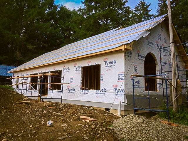 New home wrapped in house wrap with scaffolding