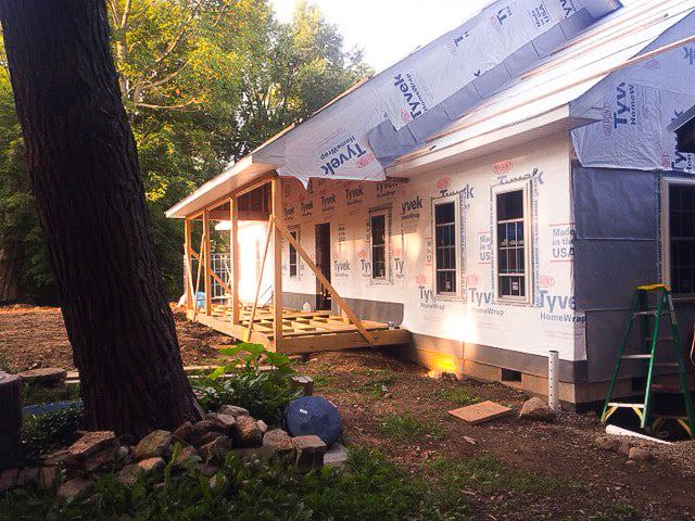 New home wrapped in house wrap at dusk