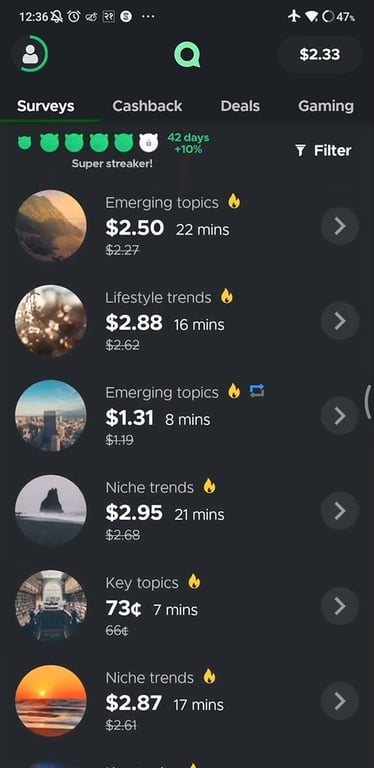 Qmee survey list with a 42-day streak adding 10% to rewards