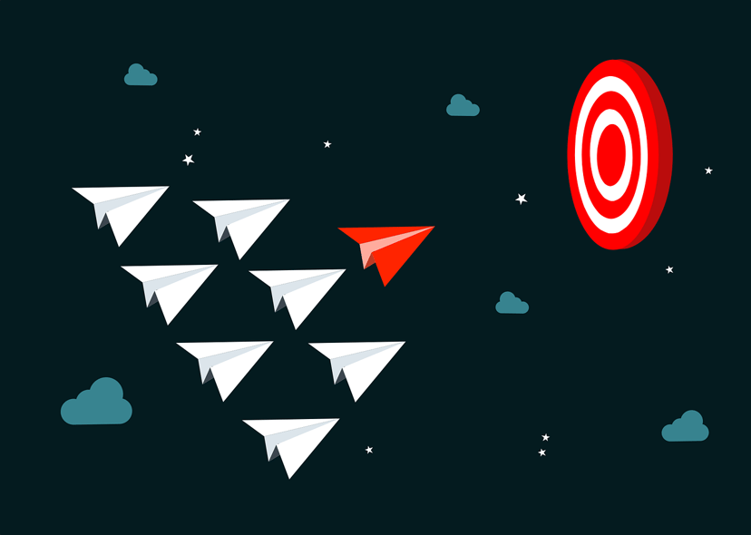 a fleet of paper planes with one leading the way to a bullseye