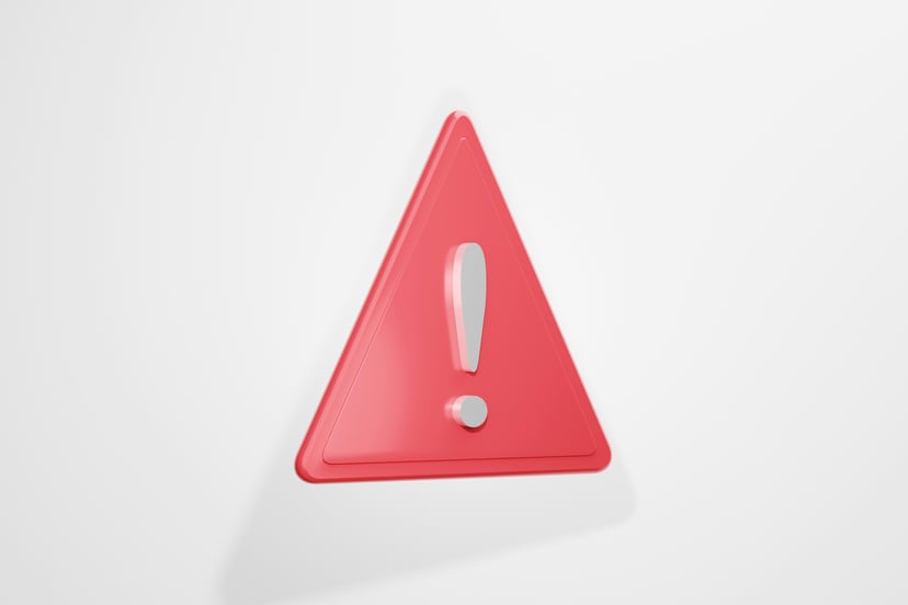 An exclamation point in a red triangle indicating a warning sign