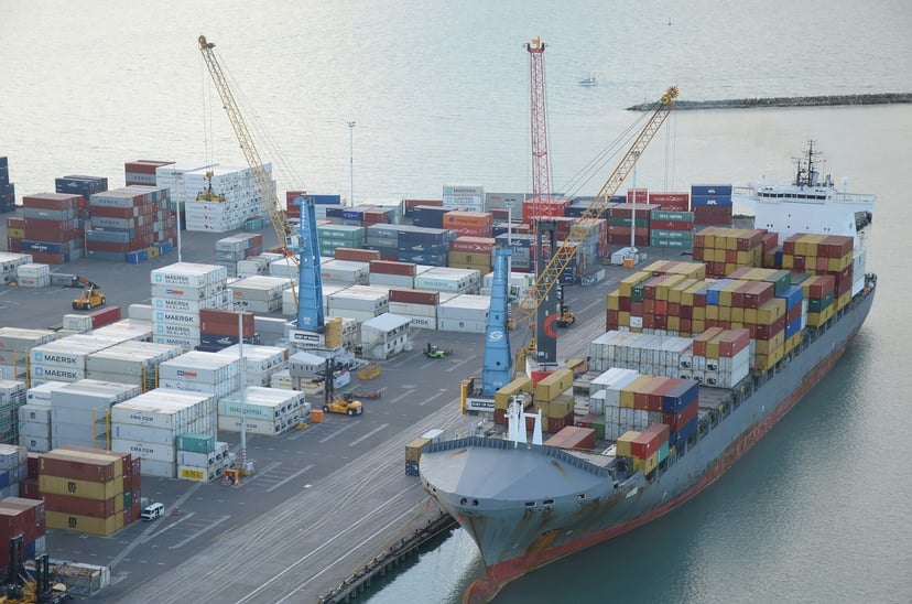A container ship docked at a terminal
