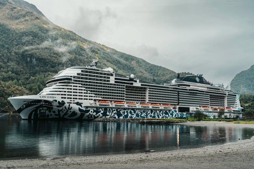 The cruise ship MSC Euribia moored near mountais