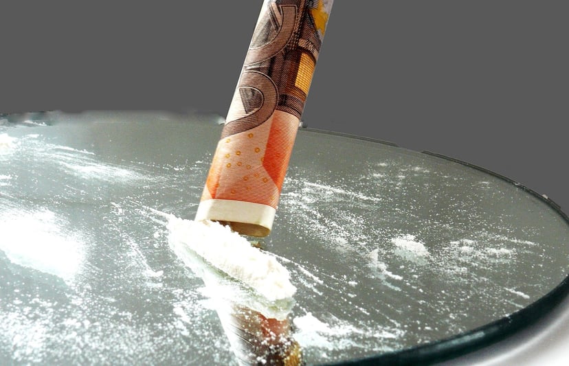 cocaine and a rolled up bank note
