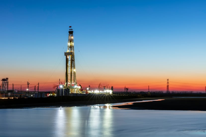 An oil rig at sunset
