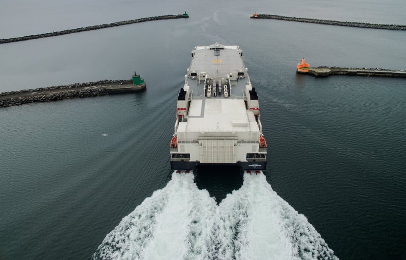a roro vessel with the wake behind it