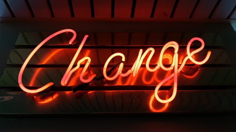 neon orange sign saying change