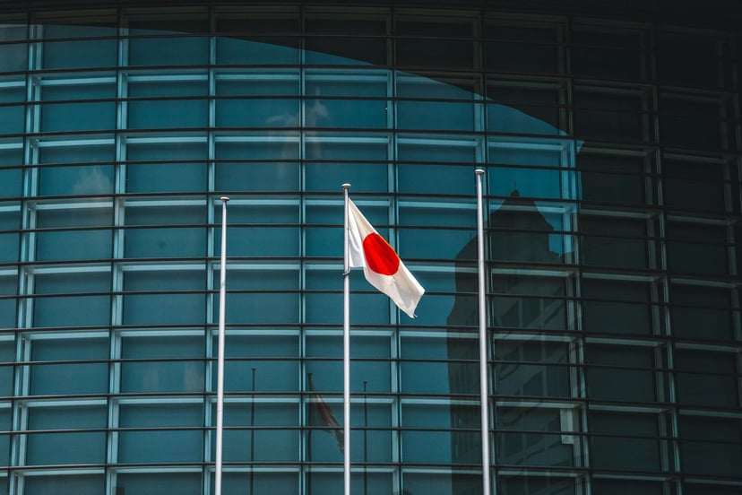 The Japanese flag flying in front of an office block