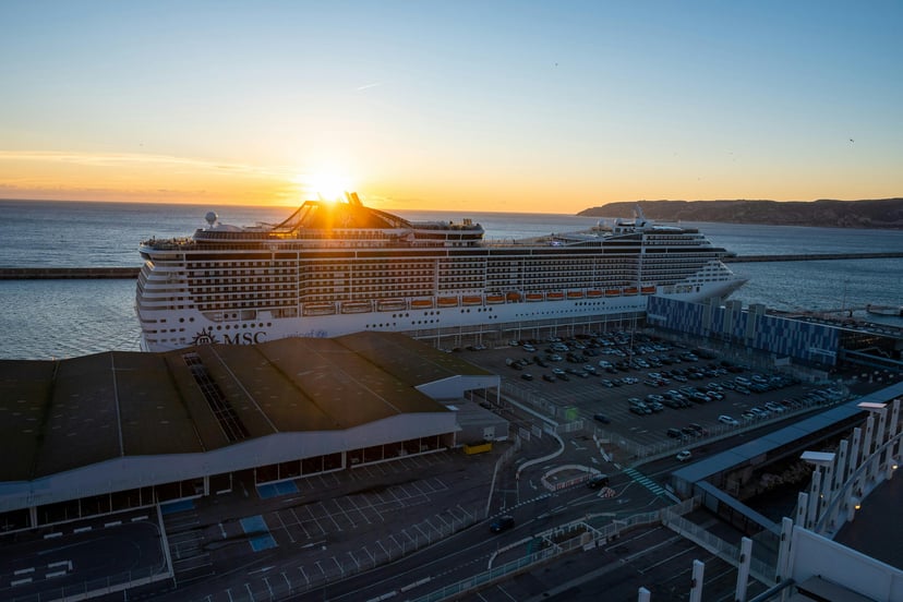 Marseille cruise port and a cruise ship at sunset