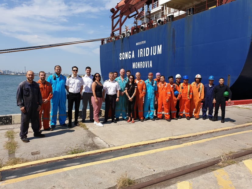 the crew, working in various seafarer jobs, standing on the dock