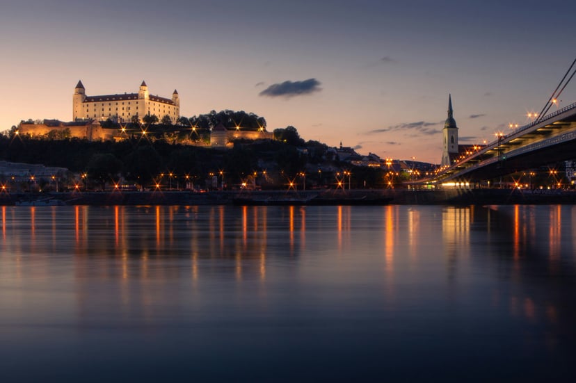 The Danube River flowing through Bratislava at dusk