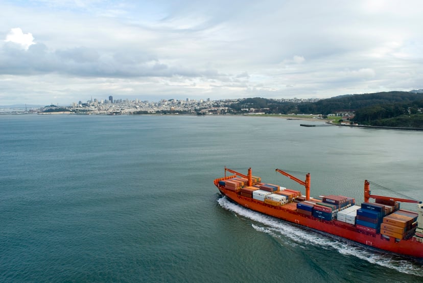 a container ship heading towards port