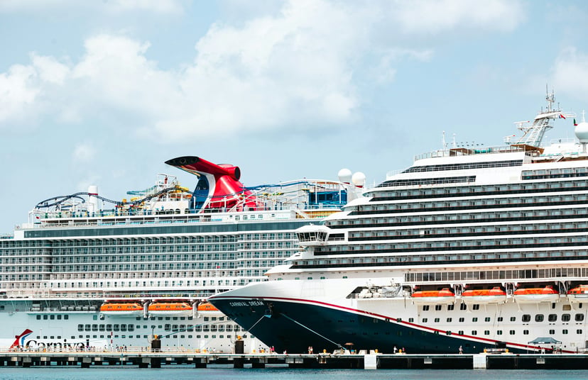 The Carnival Dream cruise ship alongside another Carnival vessel