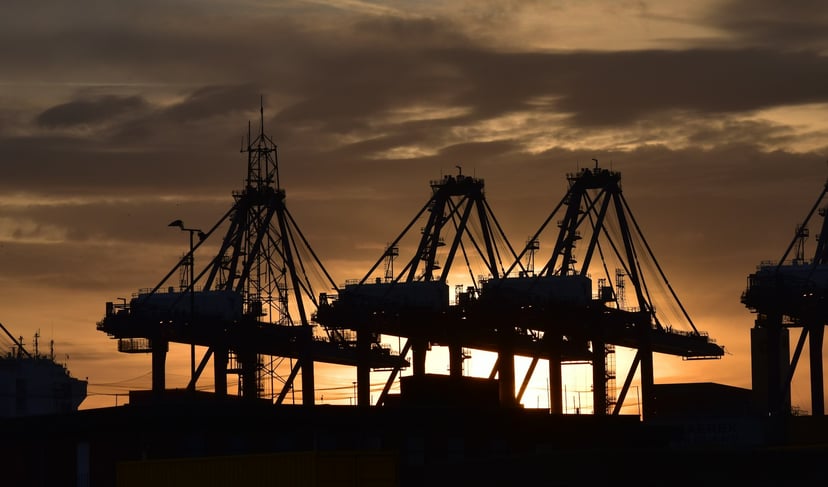 Silhouettes of cranes at Felixstowe Port at sunset