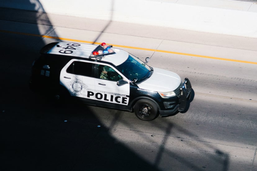Bird eye view of a police car sparked on the street