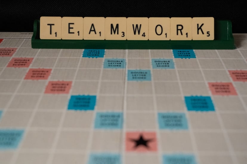 The word Teamwork spelled out in Scrabble tiles