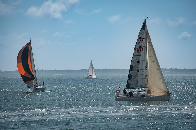 yachts sailing in different directions