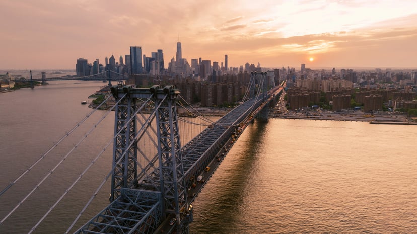 The Williamsburg bridge and New York City at sundown