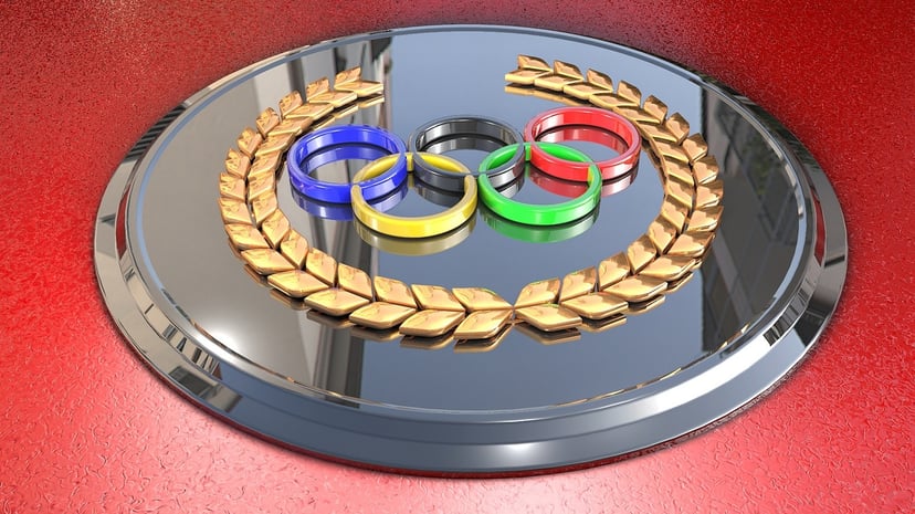 The five Olympic rings on a silver disc
