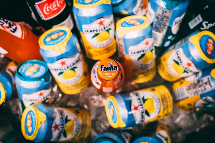 A selection of cans of soda and sarkling water