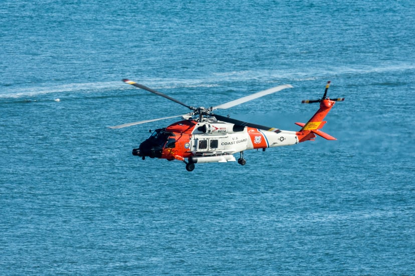 A US Coast Guard helicopter over the ocean