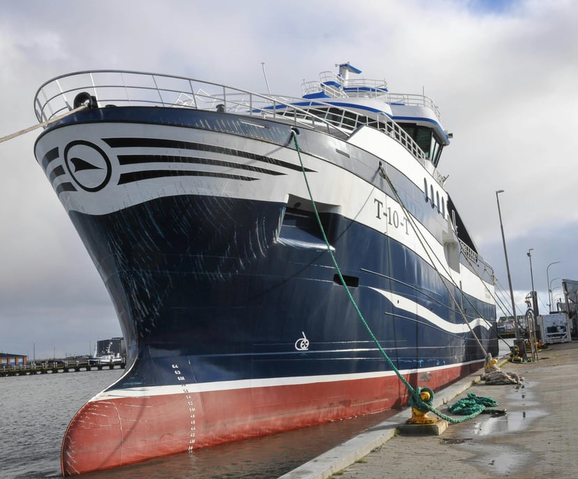 the bow of a ship showing the forecastle and mooring lines