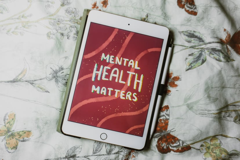 A tablet PC with 'mental health matters' on the screen