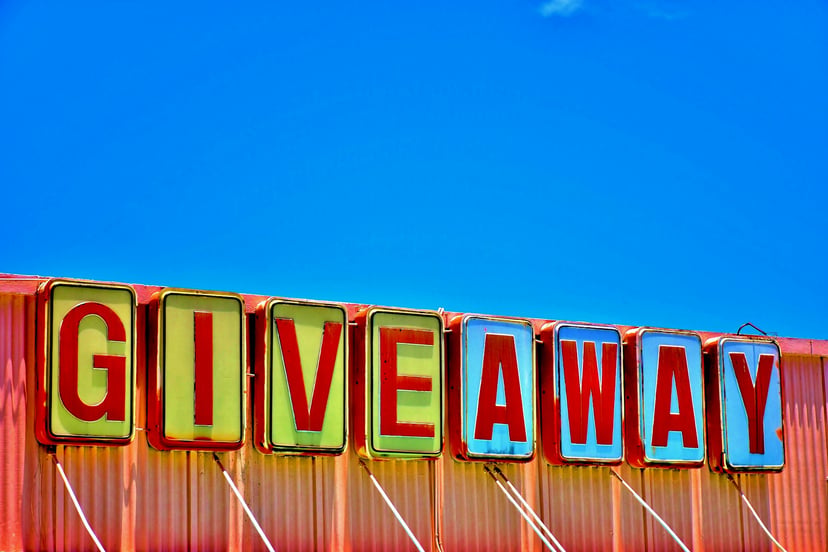 A retro sign saying 'giveaway'