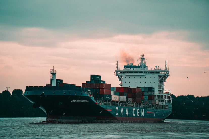 a CMA CGM container ship at dusk