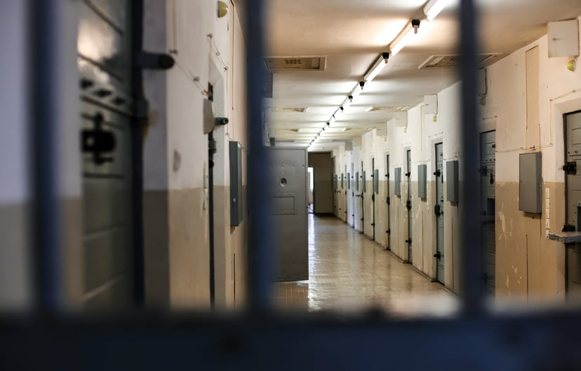 The interior of a jail showing cell doors