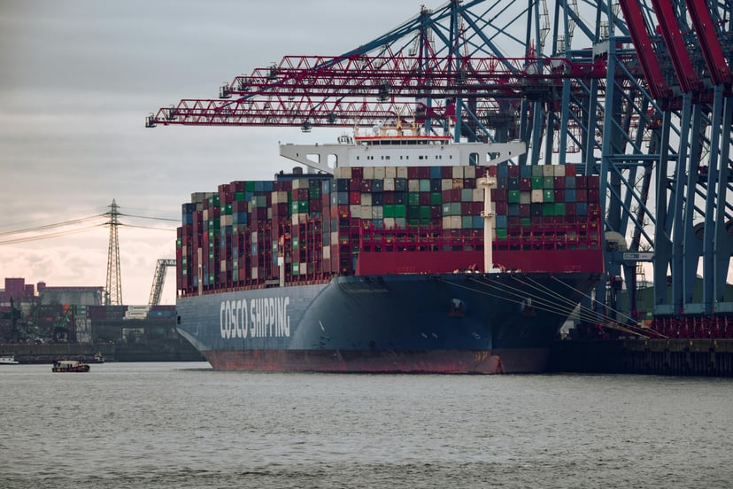 A COSCO container ship docked in the Port of Hamburg