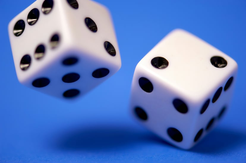 two white dice on a blue background