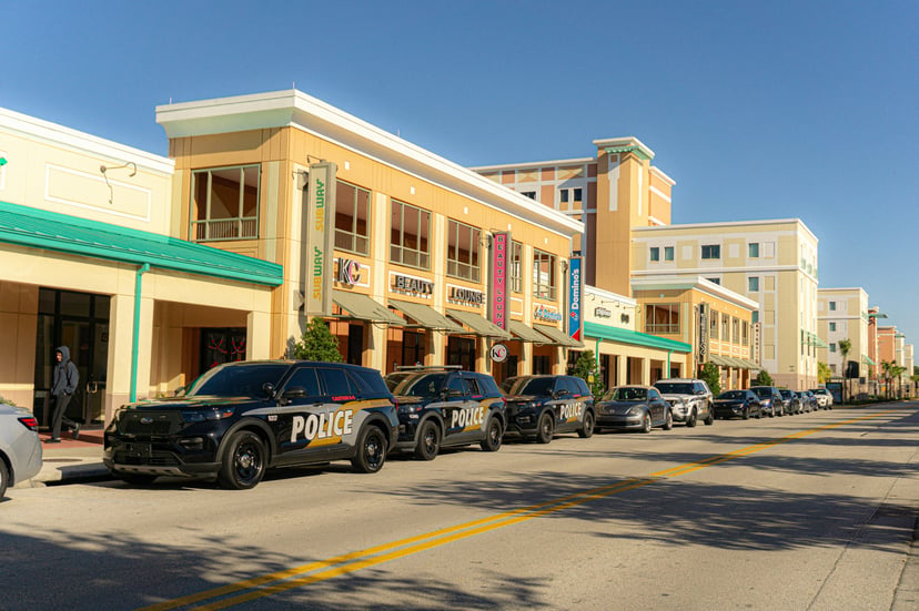 Police cars lined up in a street in Florida