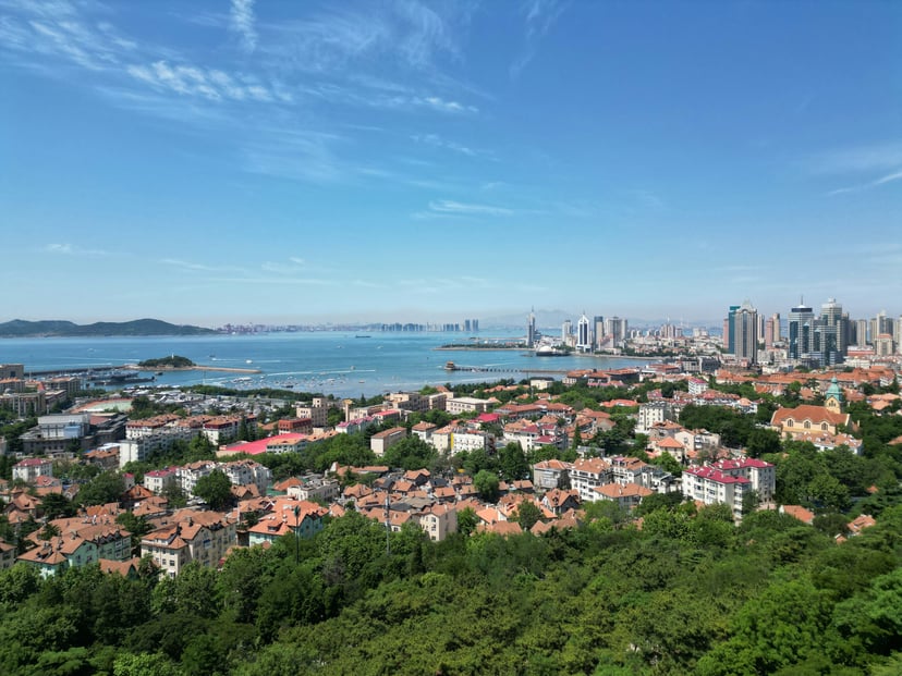 A view across Qingdao, China including the harbor