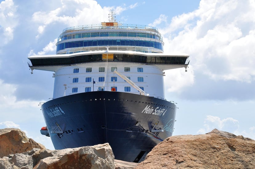A view of the Mein Schiff 4 cruise ship from beneath the bow