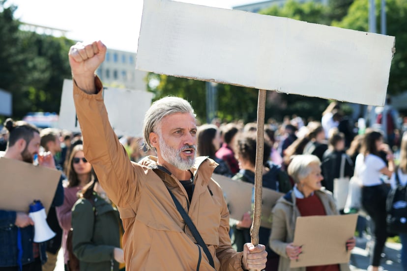 A crowd of people protesting 