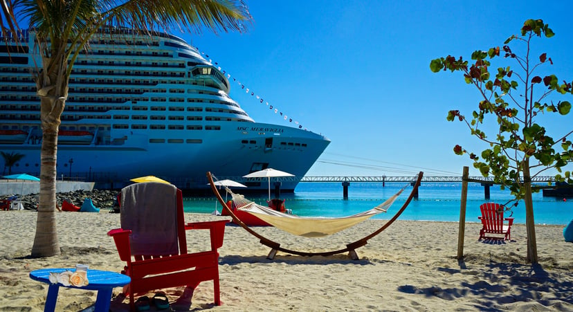 The MSC Meraviglia anchored just off a tropical beach