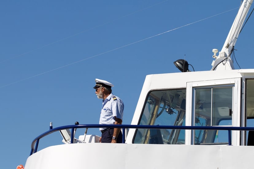 an officer on the prow of a vessel