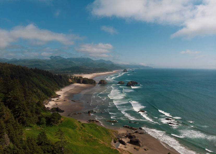 The Oregon coastline showing mountains and view out towards the Pacific ocean