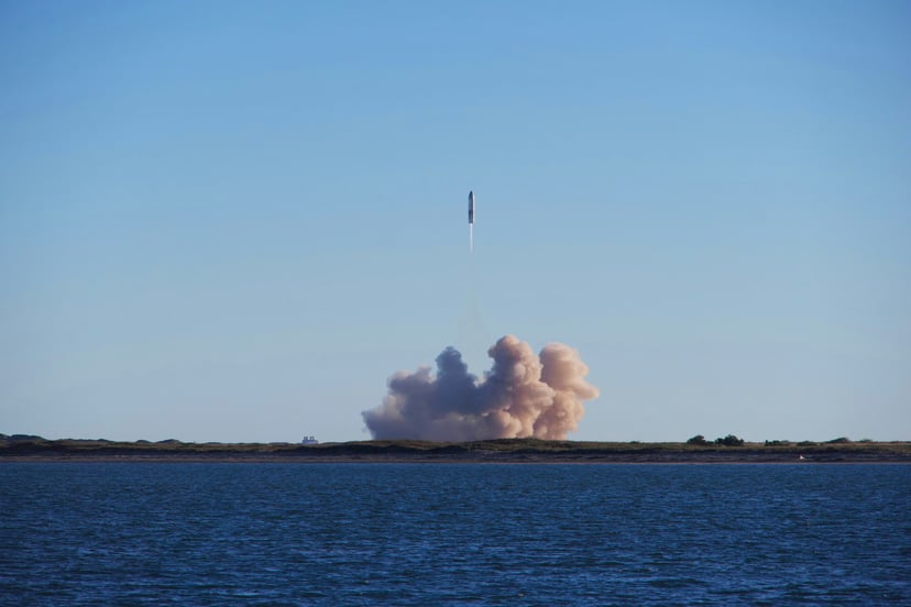 A missile being launched near water