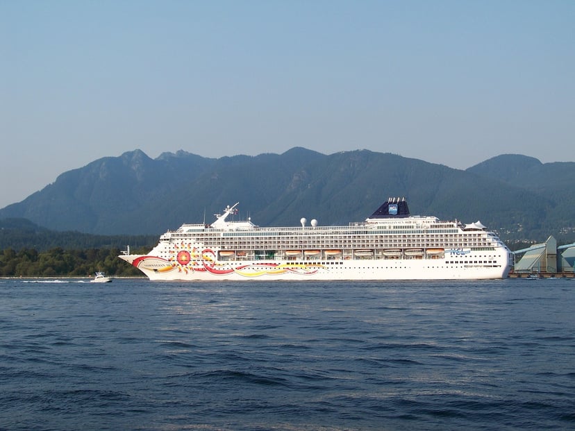 The Norwegian Sun cruise ship sailing past mountains